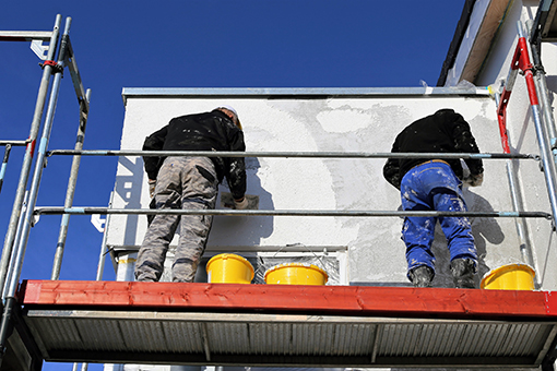 Two Painters Servicing Tampa FL Commercial Building by Painting the Exterior