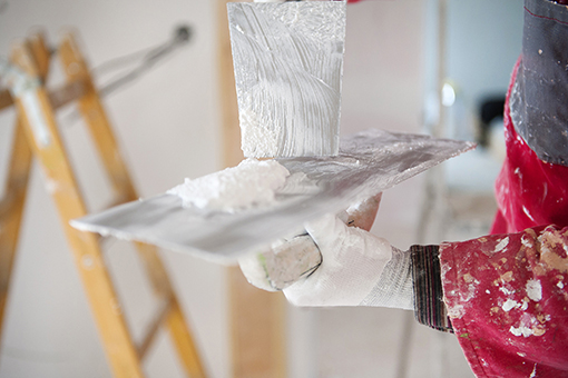 Professional Painter Mixing Paint to be Used Painting a House in Gandy FL