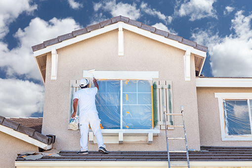 Tampa Painter Offering Residential Exterior Painting Services On The Roof To Repaint Exterior