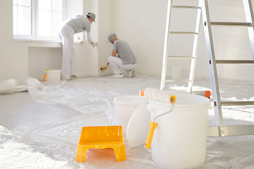 Two Tampa FL Painters Working Complete with Paint Buckets, Rollers, Brush and Ladder