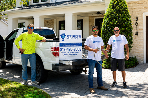 Commercial Painters in Tampa Florida Leaving Their Company Vehicle To Start Painting Project