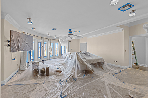 Wall and Furnitured Covered with Plastic Before Starting Residential Interior Painting Service in a Tampa Property